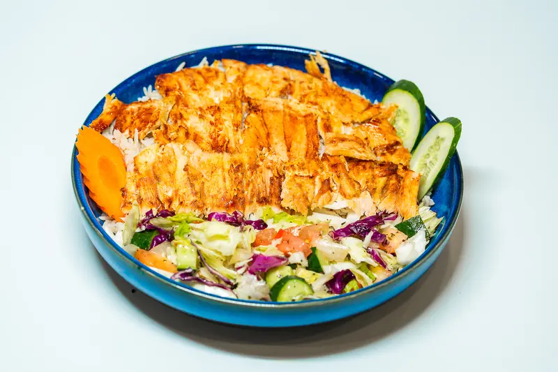 shawarma rice شاورما مع الرز chicken shawarma slices with white rice served with arabic salad, vegetables and result
