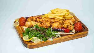 shish tawook شيش طاووق grilled chicken breast skewers served with french fries and garlic sauce