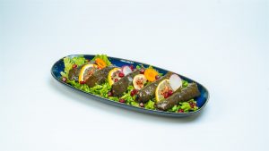 Rolled grape leaves on a plate